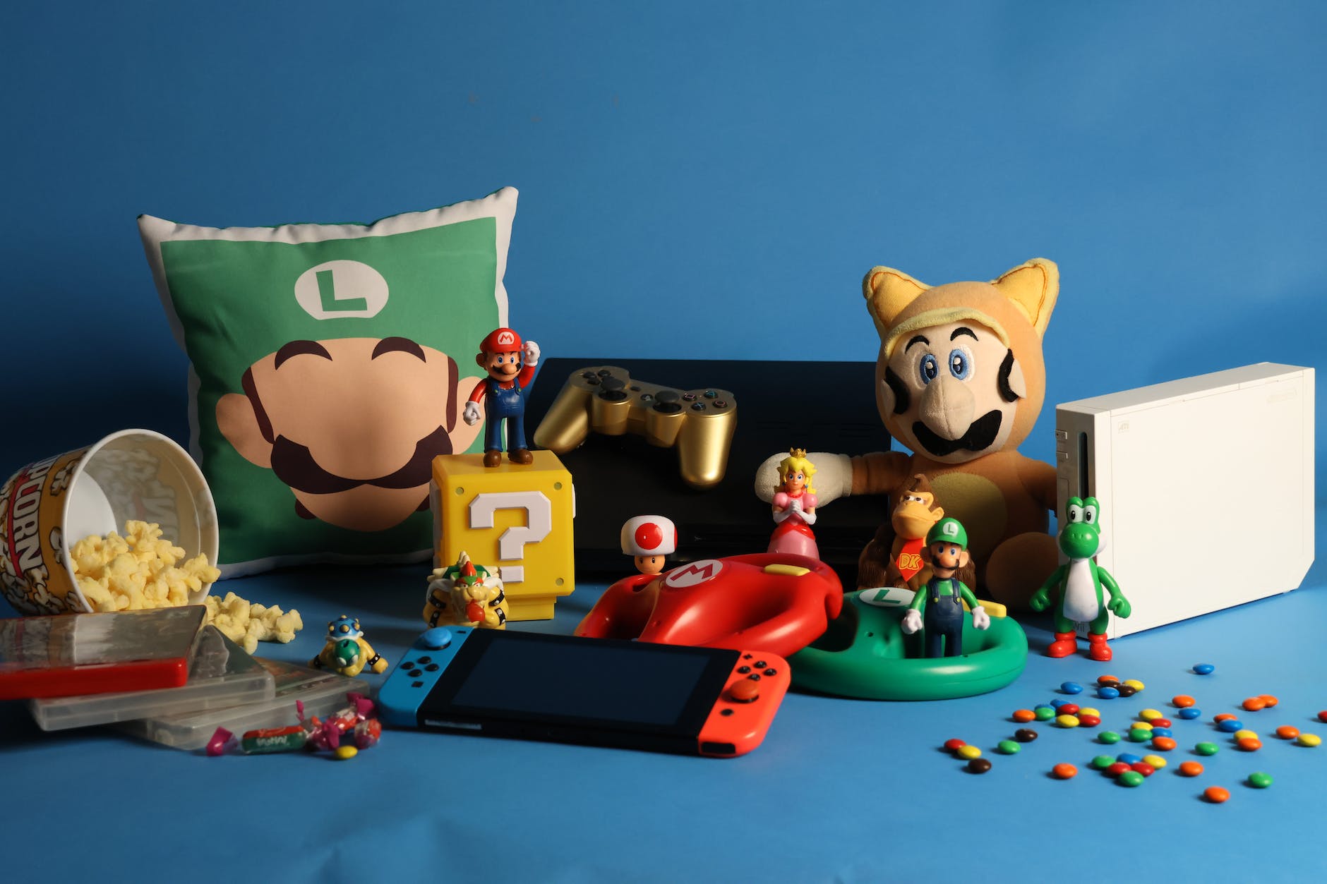 a nintendo switch and a bunch of super mario game items