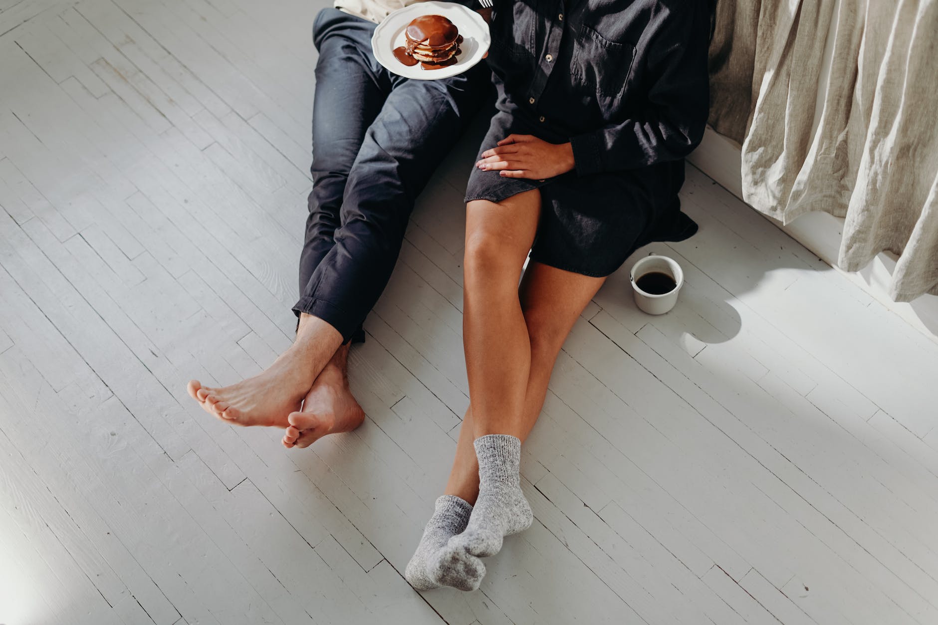 a couple having breakfast on the floor