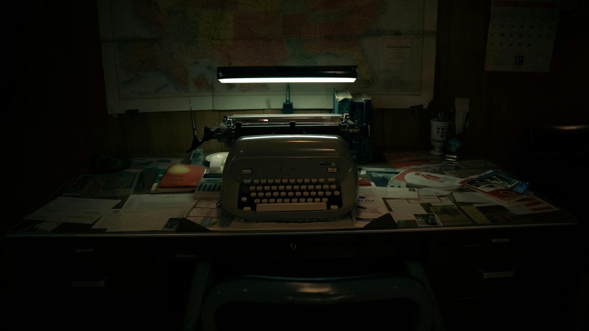 vintage typewriter on desk in dimly lit room