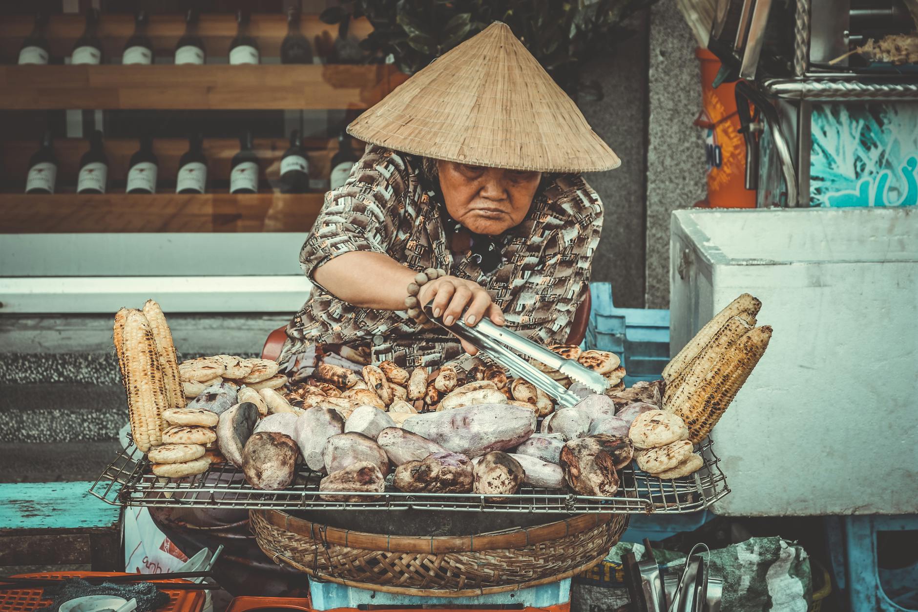woman selling grilled root crops