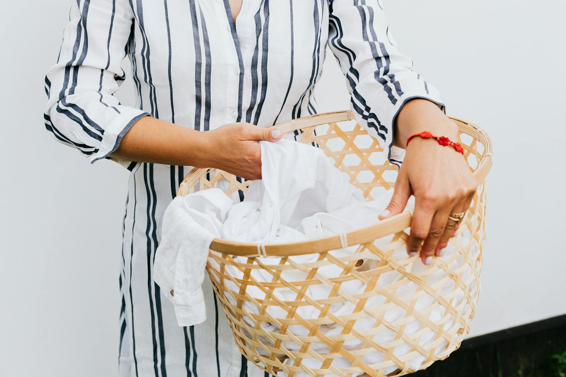 photo of a person s hands holding a basket