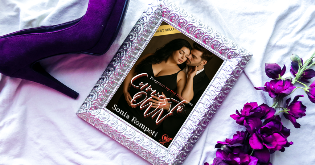 A close-up of a purple high heel next to a framed book cover of 'Curves to Own' by Sonia Rompoti, accompanied by purple flowers on a white surface.