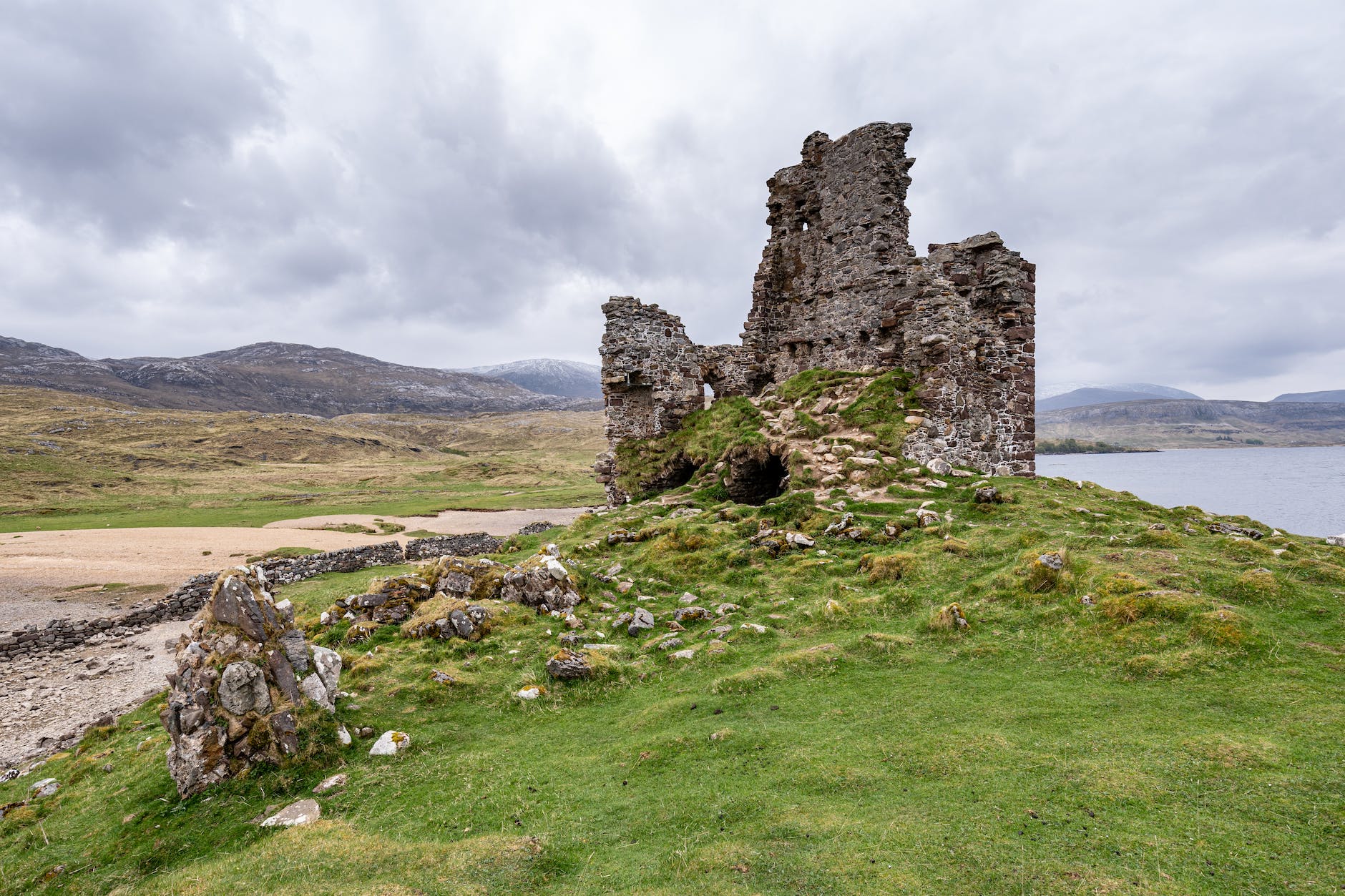 gray rock formation under gloomy sky