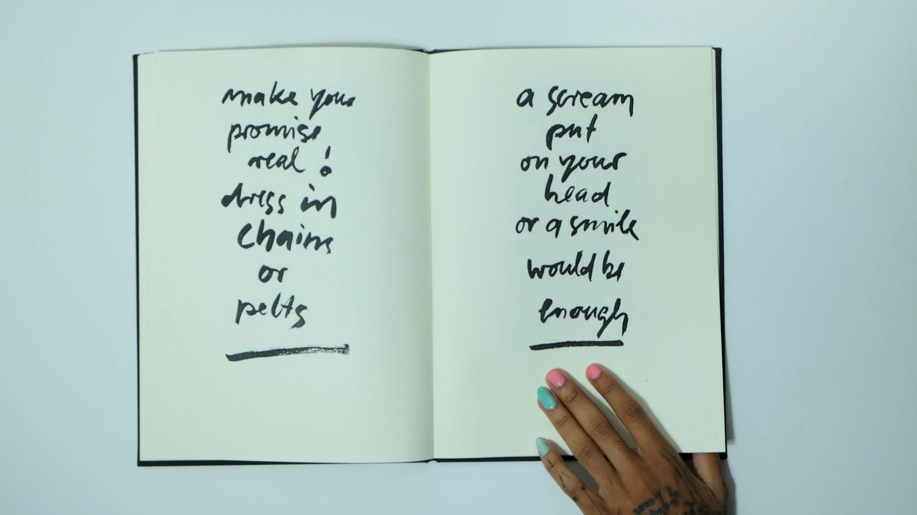 crop faceless informal woman with opened notebook