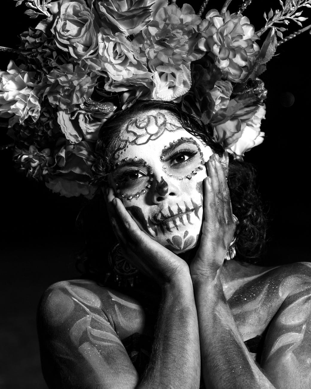 woman wearing makeup for the day of the dead celebrations in mexico